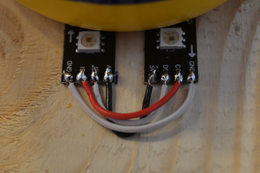 Detail view of solder connections between two APA102 LED strips