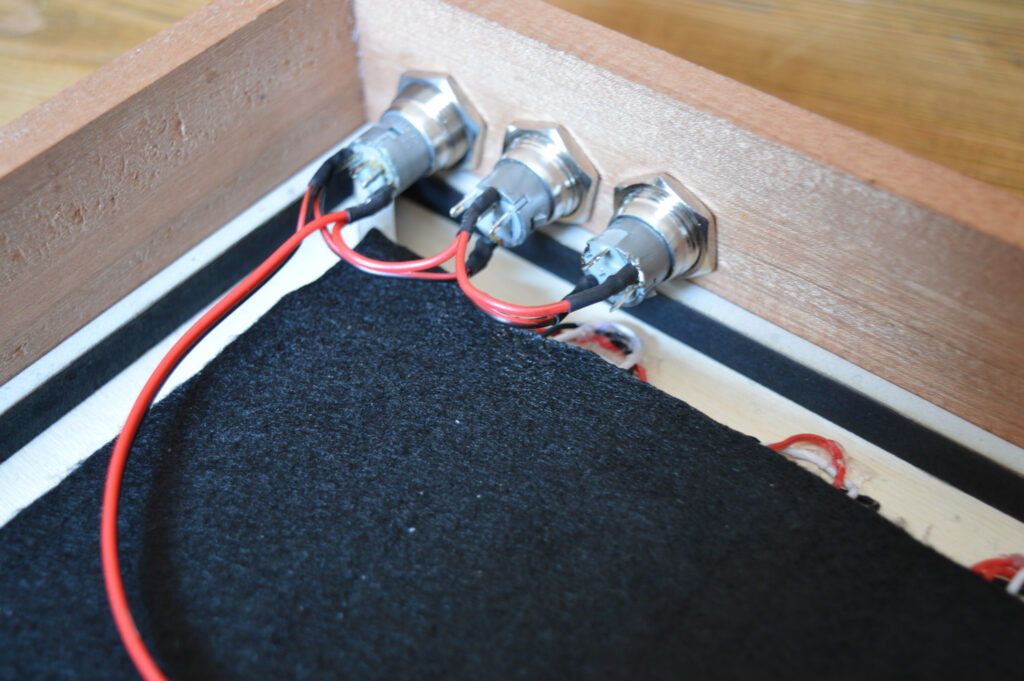 Power wires soldered to the push buttons in the ClockSquared frame