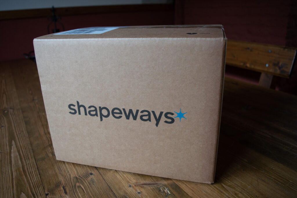 A shapeways box containing 3D printed parts