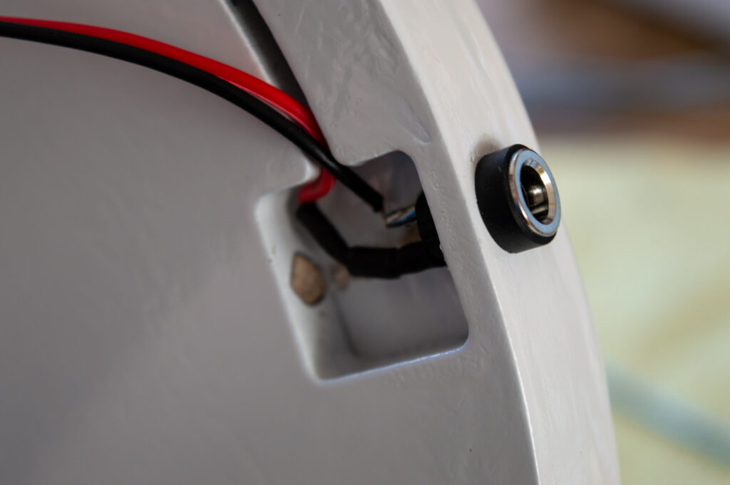 Placement of the power connector within the frame